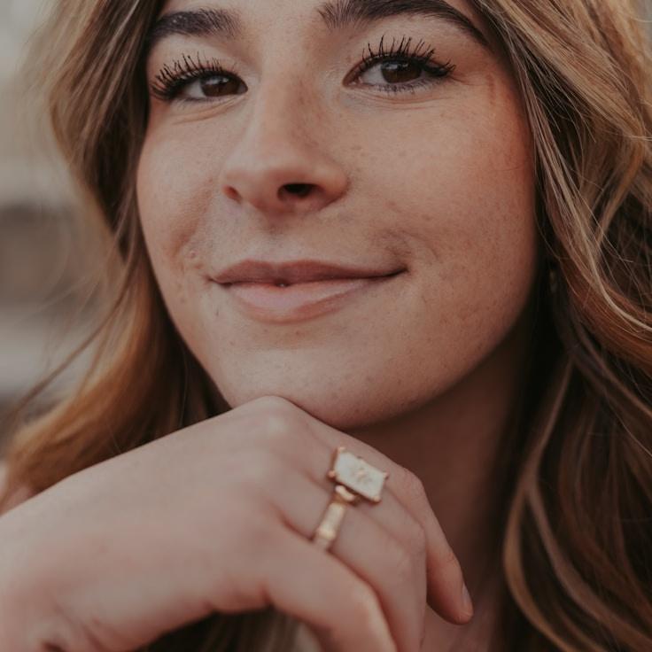 Kaveri Mehta, Lead Design Curator at Orbitalsy Nergy, reviewing corporate floral arrangements